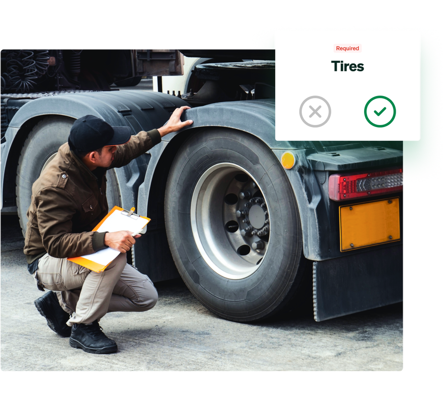 An employee using Fleetio Go to complete a tire inspection on a truck.
