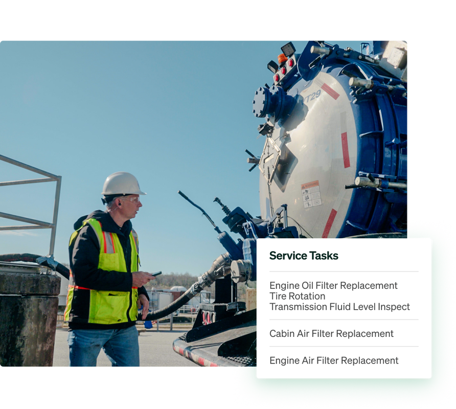 A service technician checking a utility vehicle's service tasks in Fleetio's utility management platform.