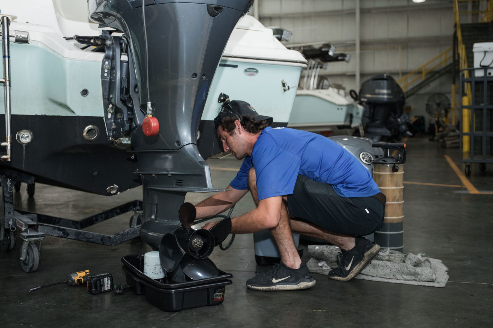 Employee doing maintenance on a boat